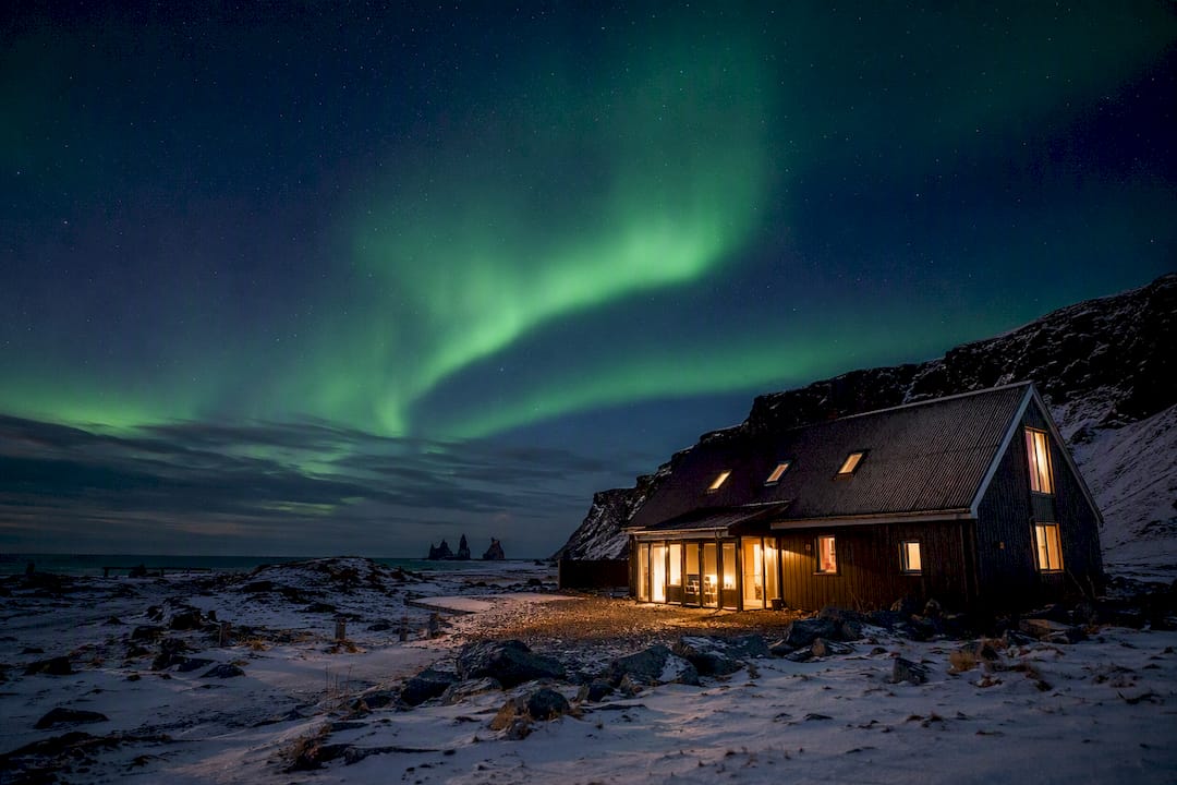 Fox Hostel barn with northern lights overhead