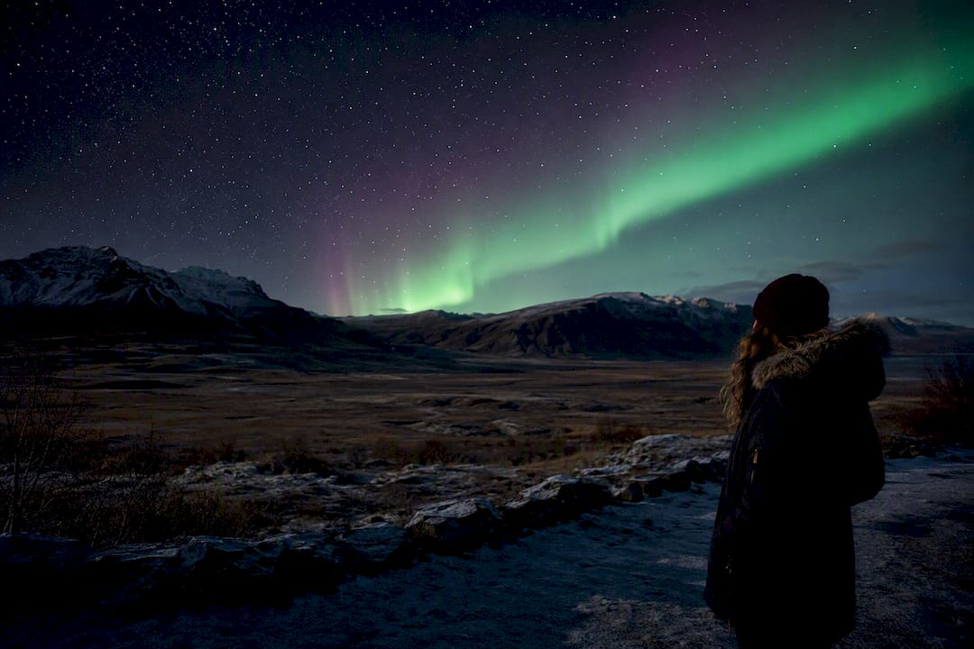 Northern Lights over Iceland countryside at night
