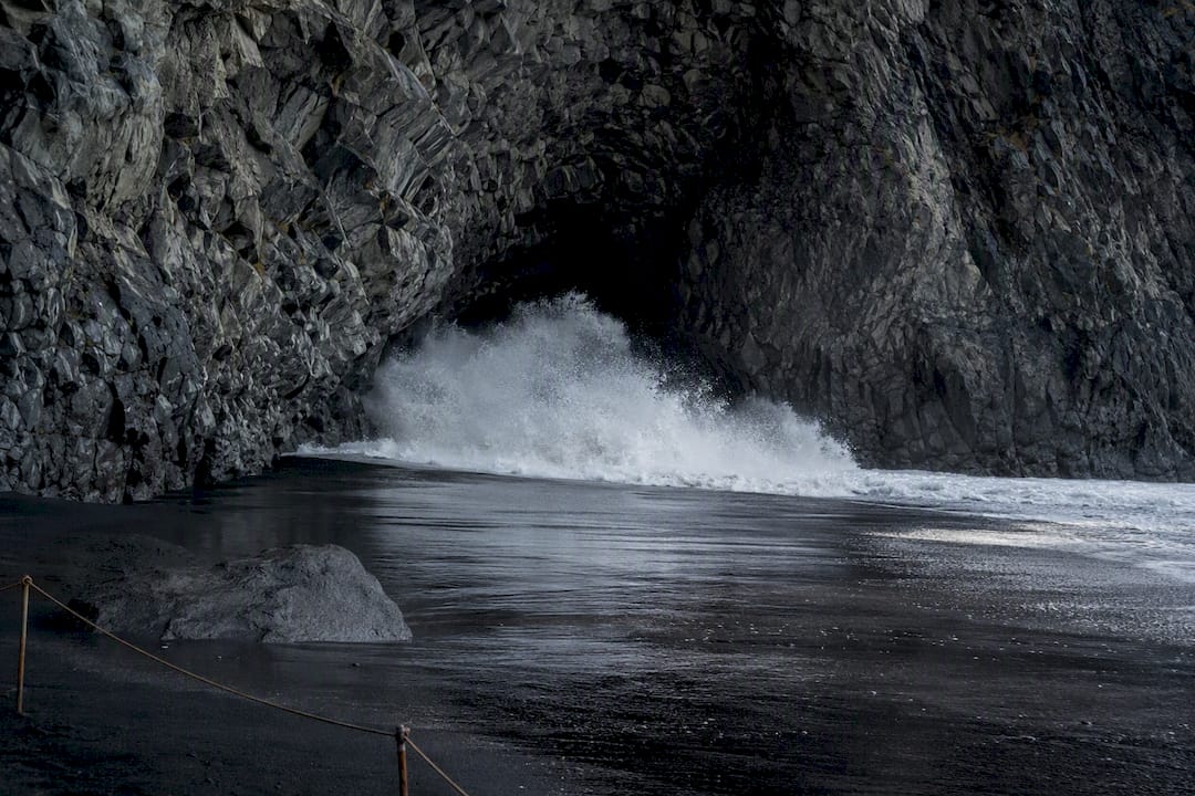 Wave surging into Reynisfjara sea cave