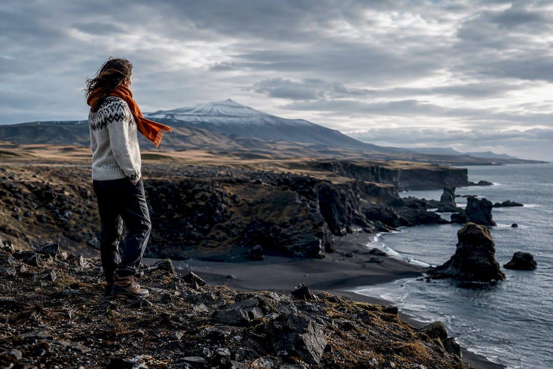 Traveler overlooking Snæfellsnes coastal landscape