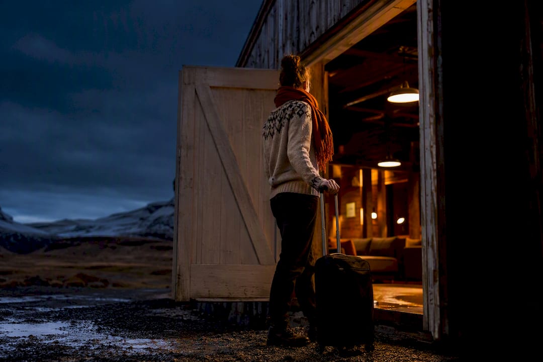 Traveler arriving at Iceland hostel after dark