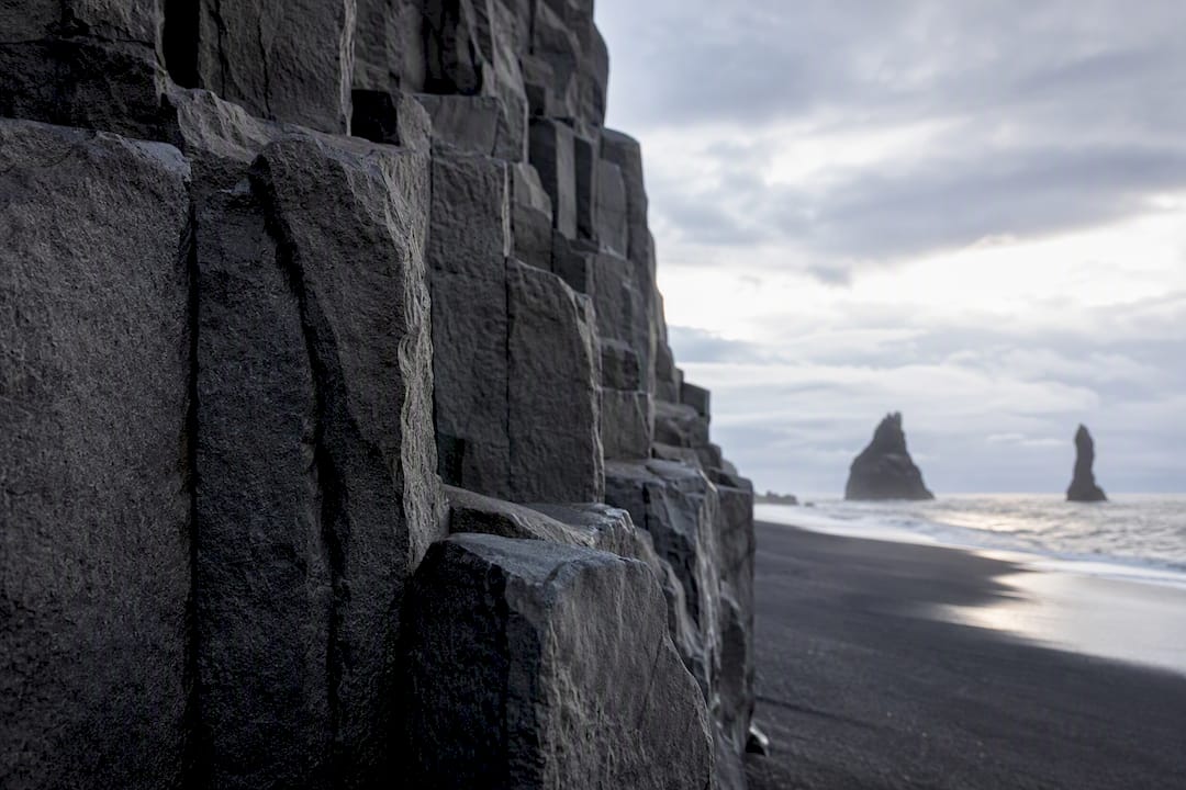 Basalt columns rising above Reynisfjara beach