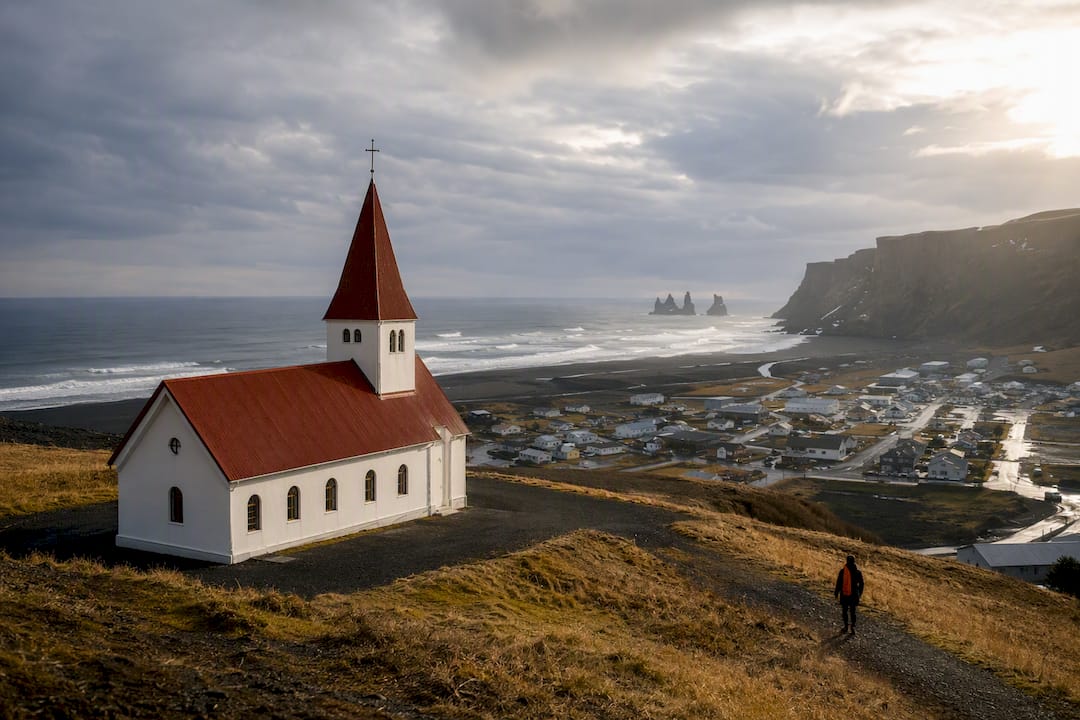 Vík church above Iceland’s black coastline