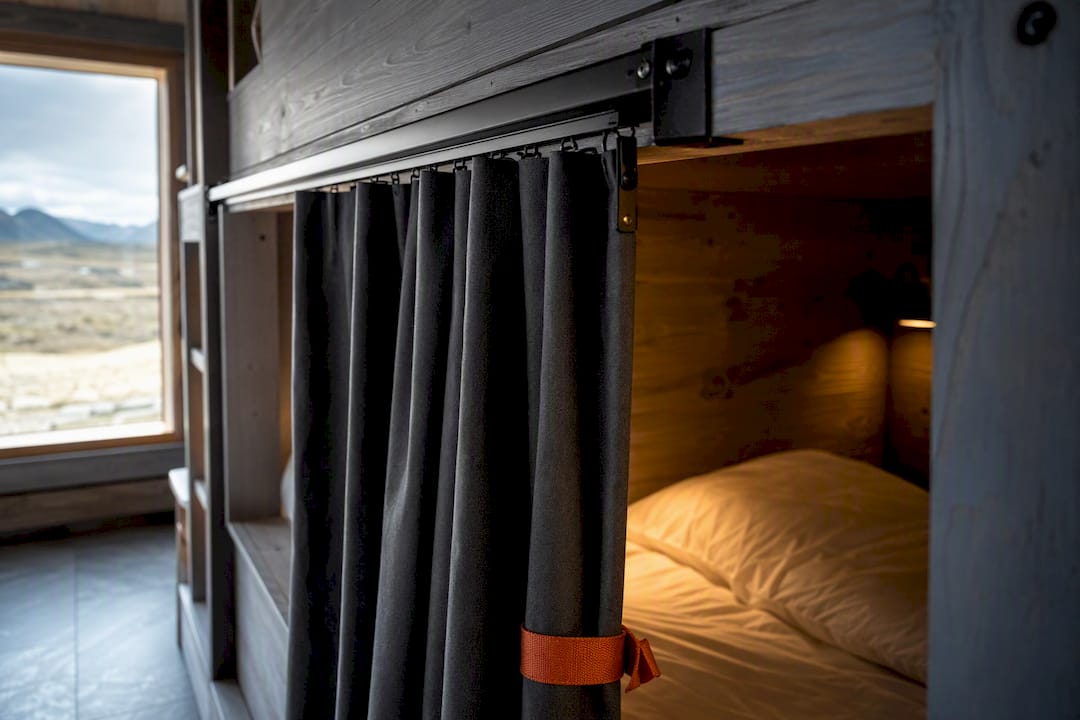 Hostel bunk with blackout privacy curtain