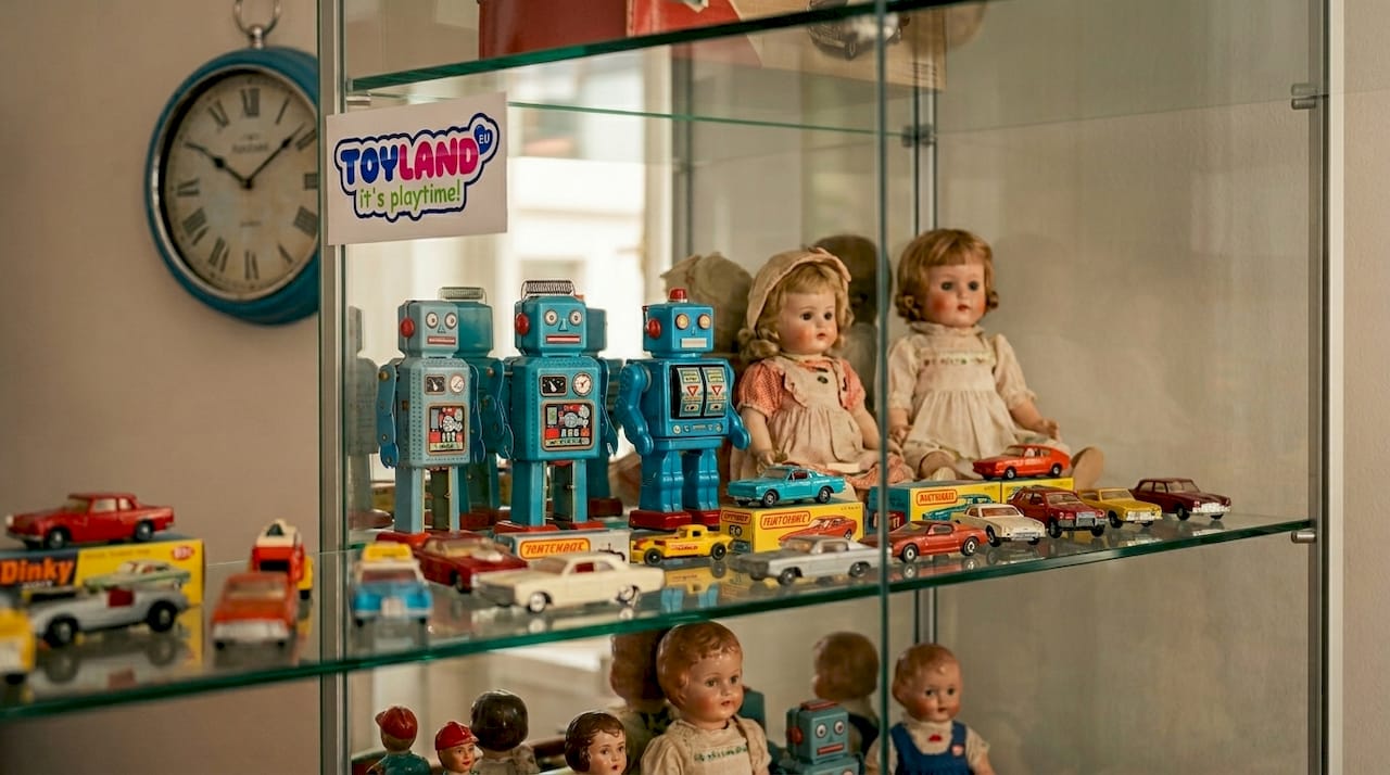 Glass case with vintage toys on display