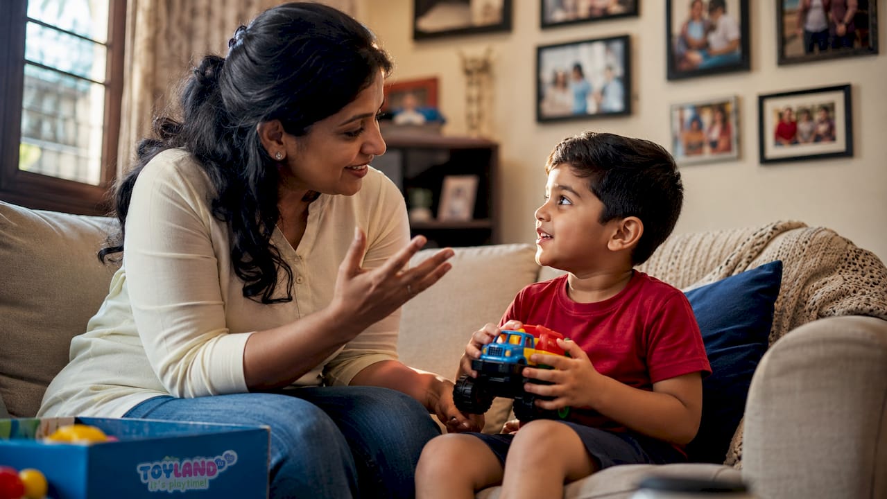 Mother explaining toy choices to son