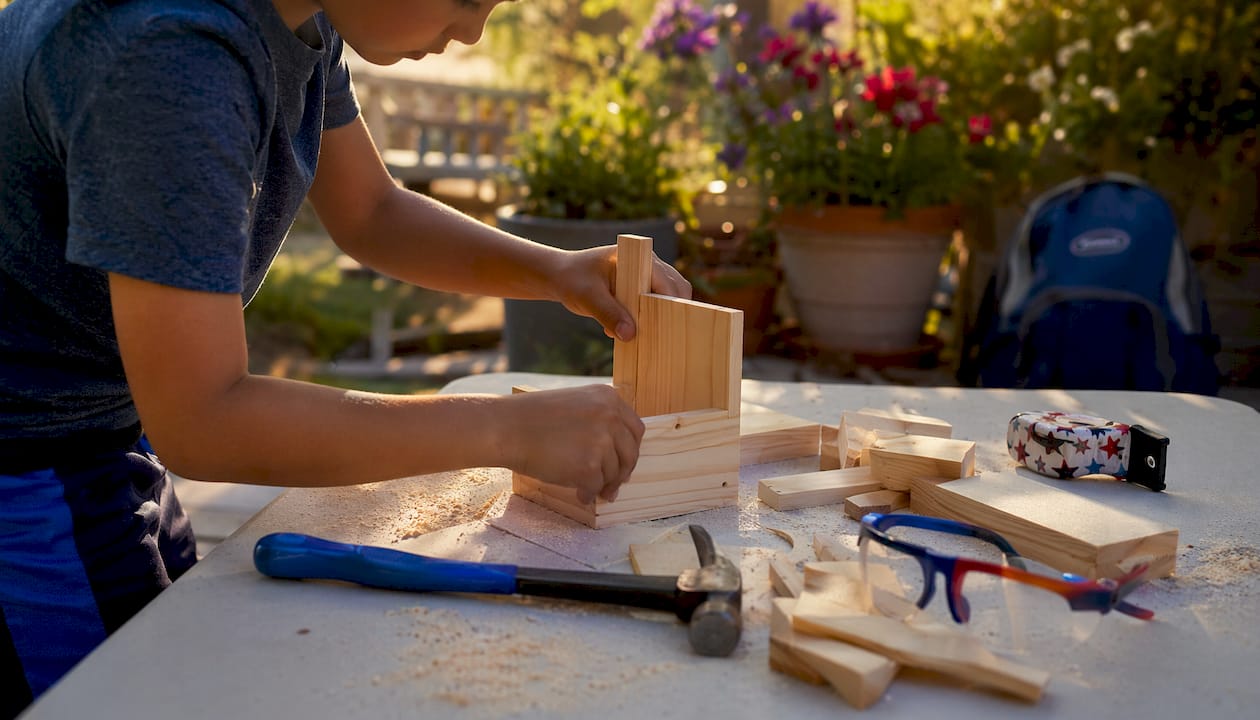 Child assembling beginner woodworking project
