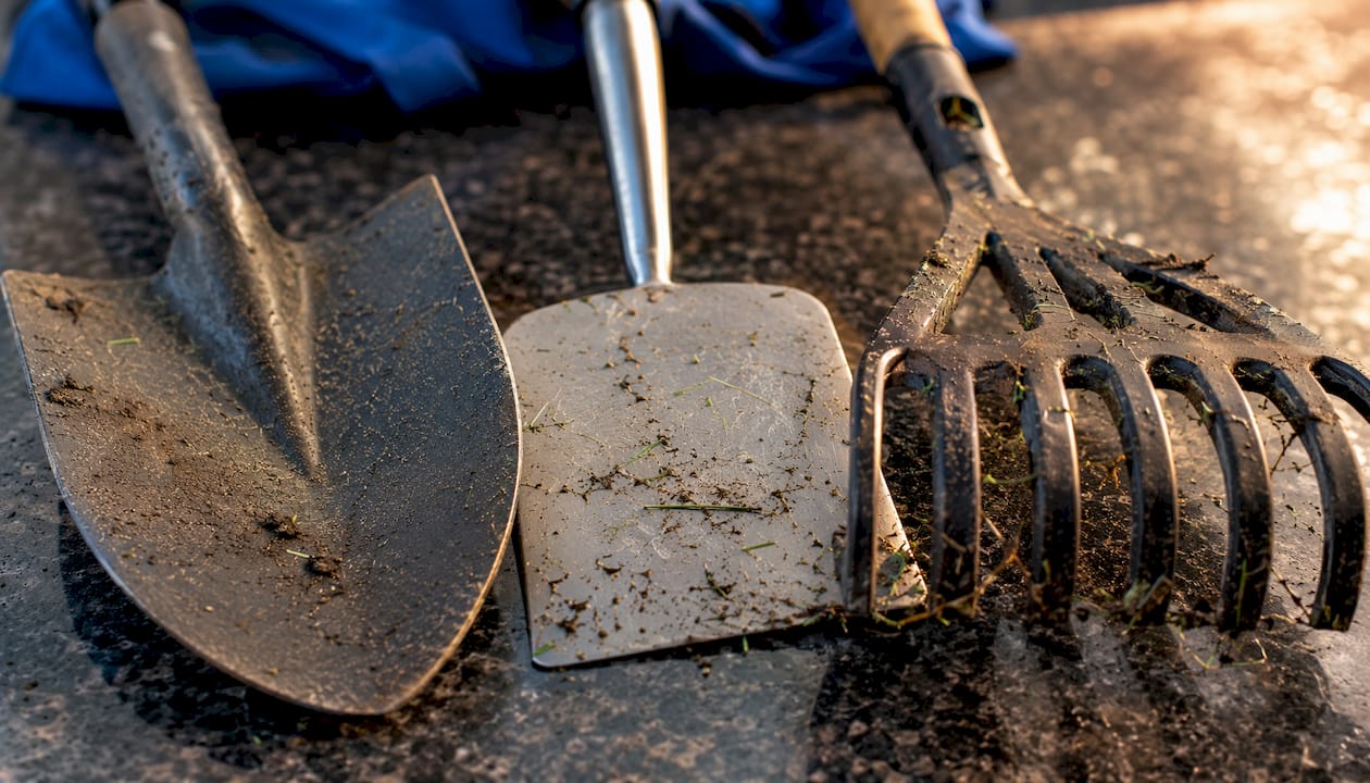 Close-up of different yard tool head materials