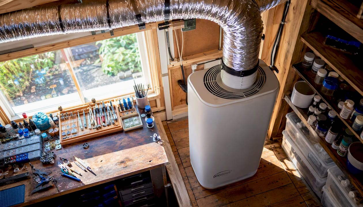 Garage hobby space with ventilation system and equipment