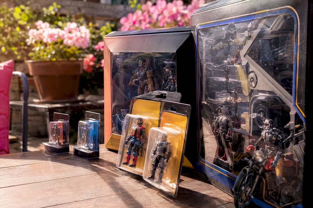 Variety of action figure packaging sizes on table
