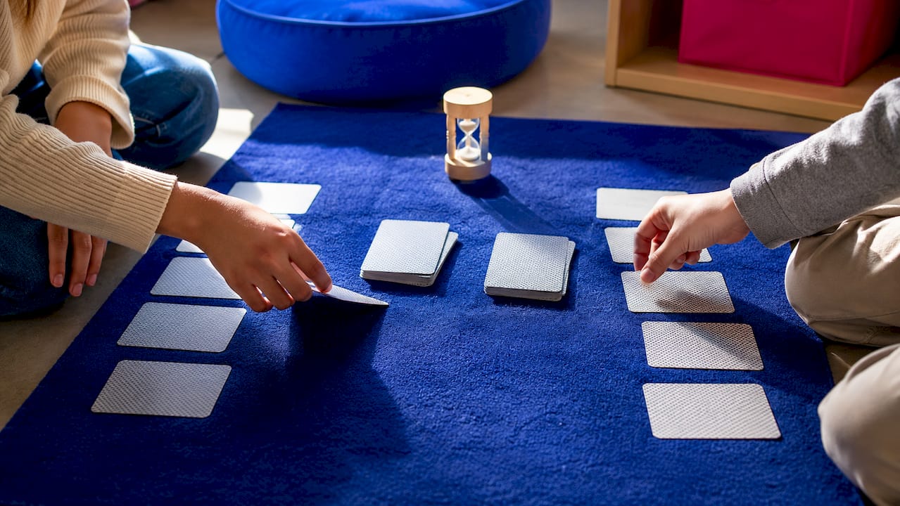 Children playing a multiplication card game