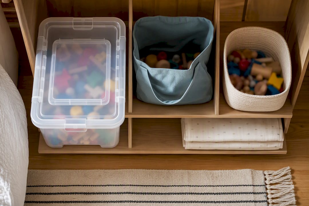 Different toy storage containers on shelving