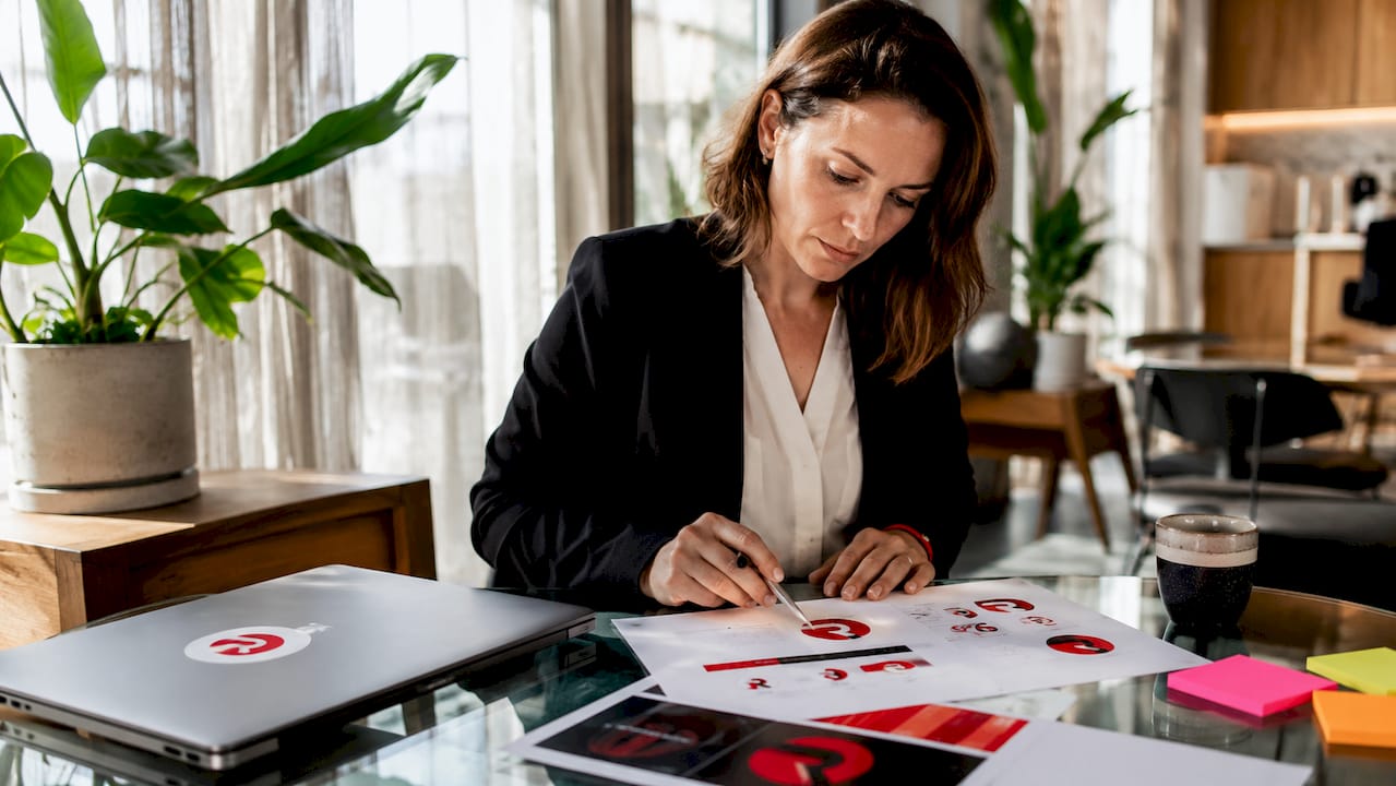 Entrepreneur reviewing brand strategy documents at desk