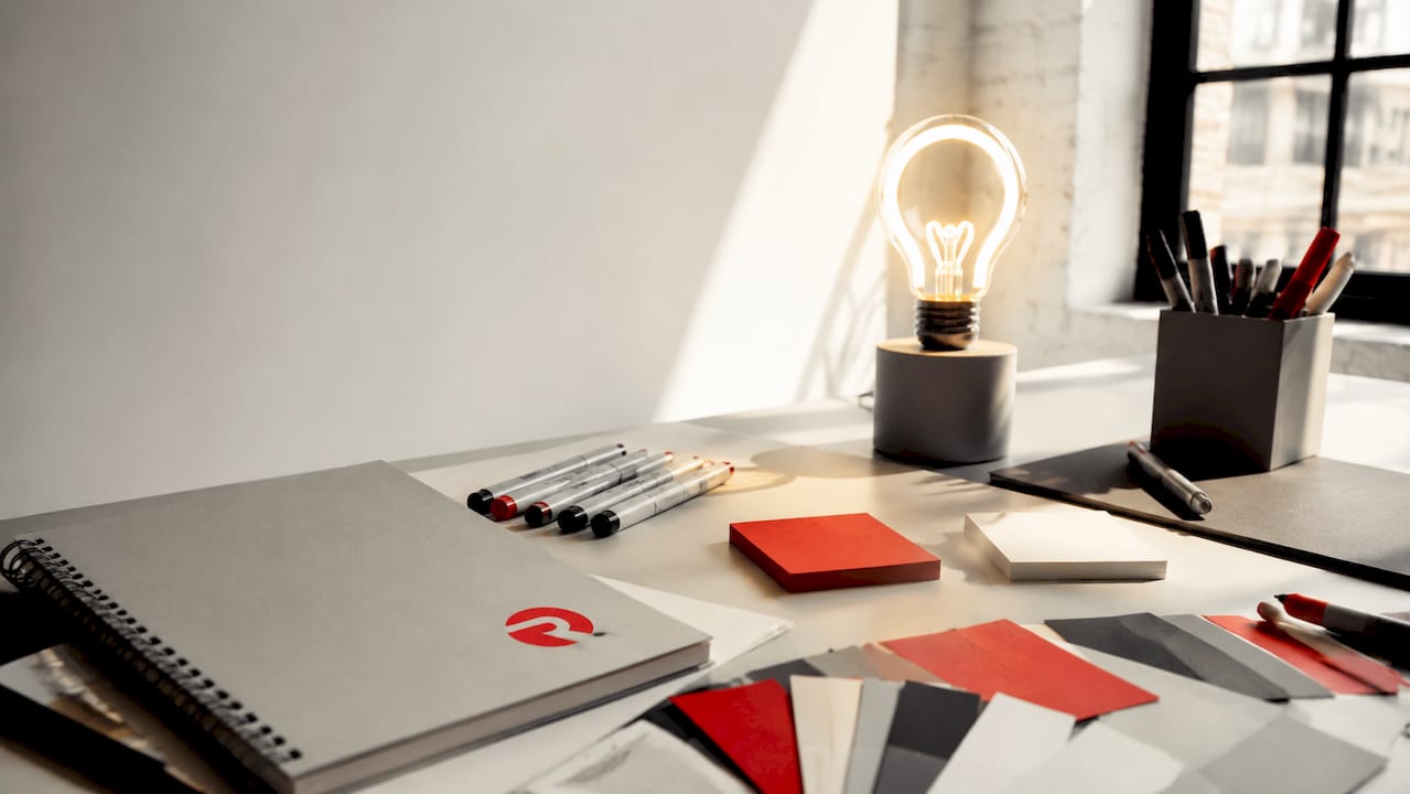 Creative branded workspace with lightbulb lamp
