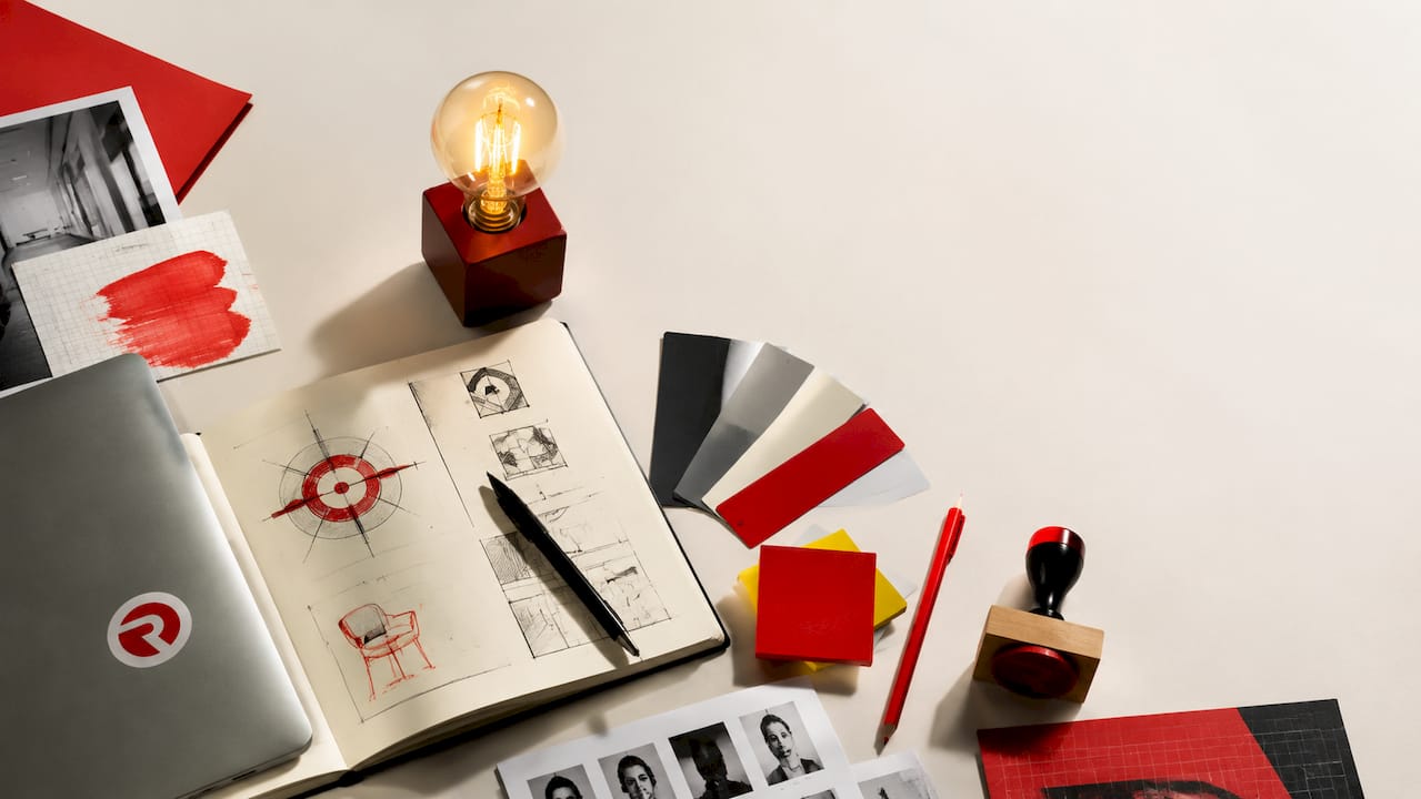 Flat-lay of cross-cultural marketing research materials and creative tools