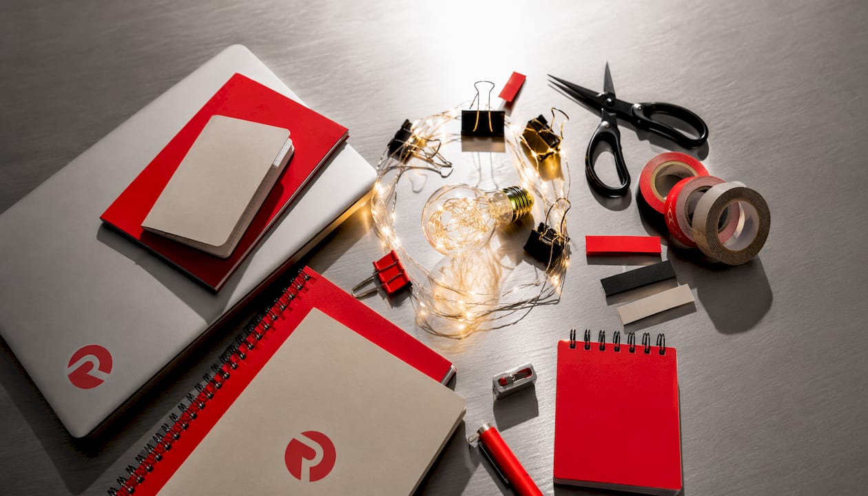 Marketing supplies and glowing bulb bold flat-lay