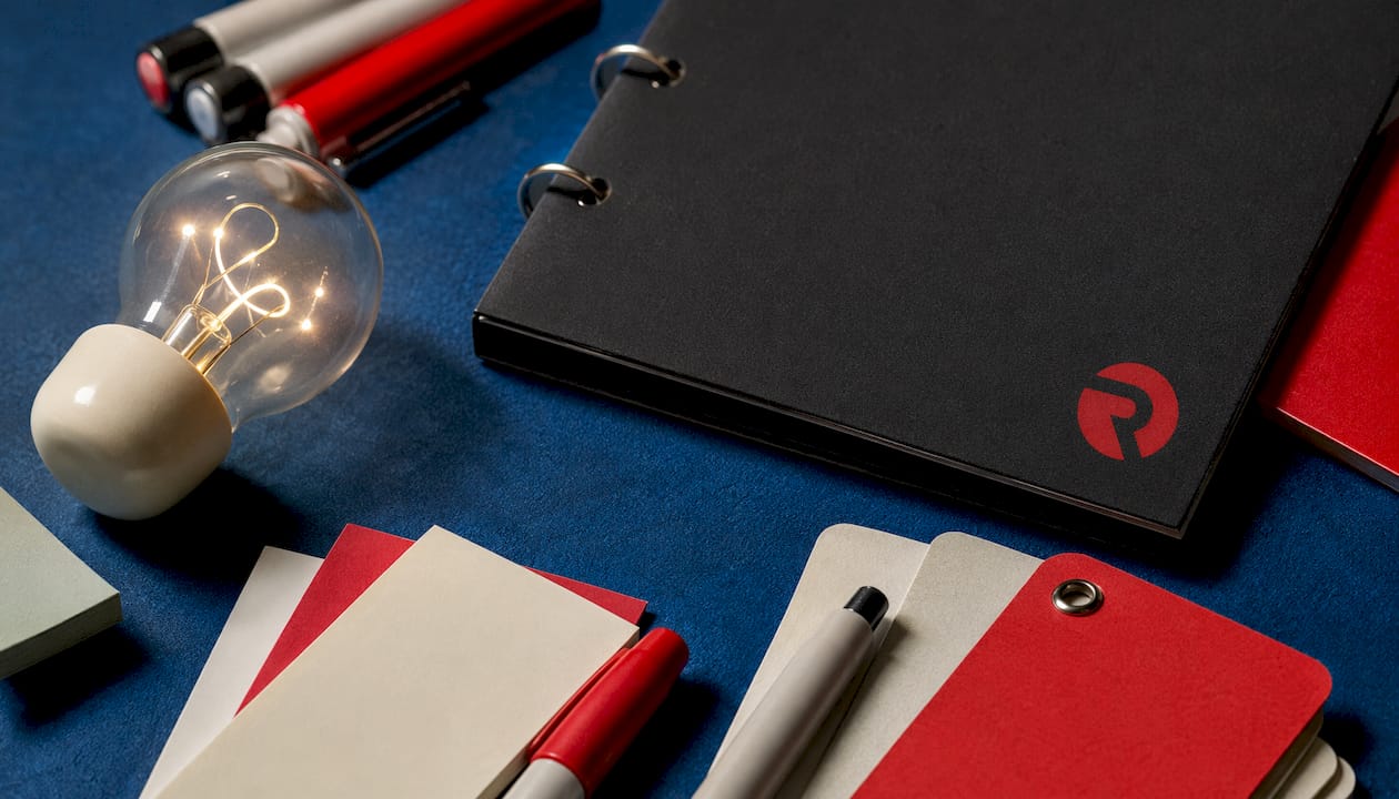 Branded flat-lay with creative supplies and bulb