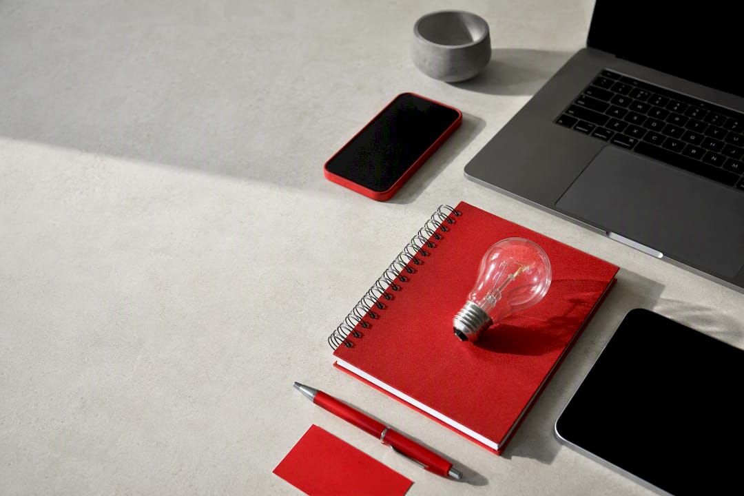 Creative workspace with unlit devices and bulb