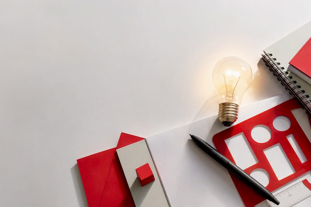 Flat-lay of branded tools with glowing bulb symbolizing trust