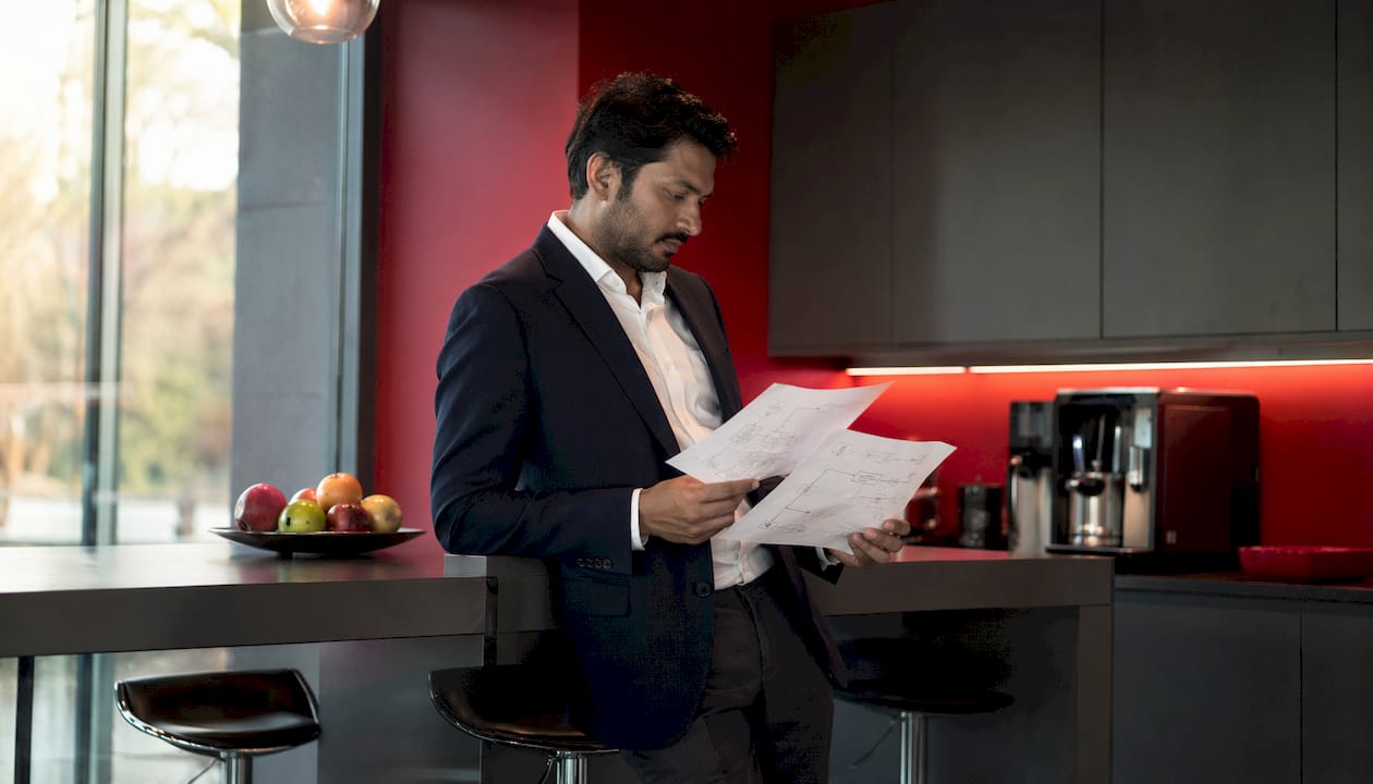 IT manager reviewing printed automation workflows