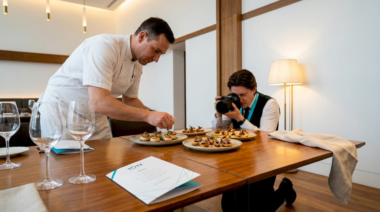 Chef and marketer prepare restaurant event shoot