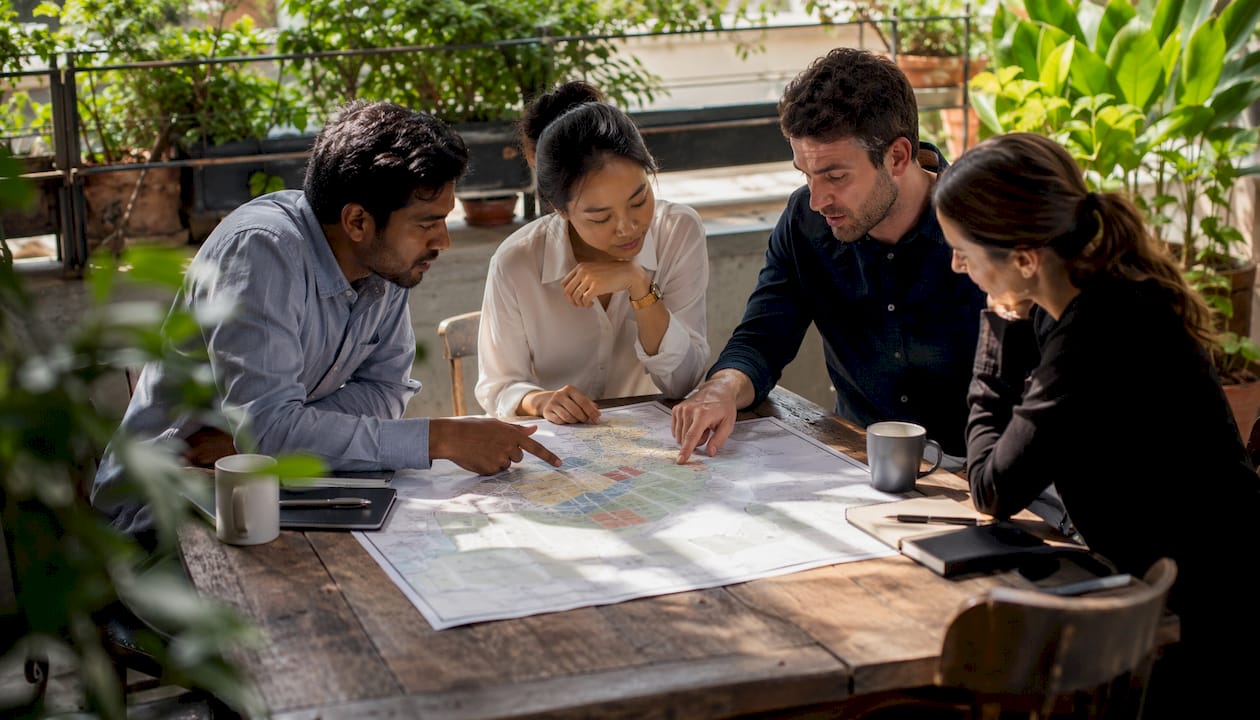 Marketing team analyzing restaurant geographic data map