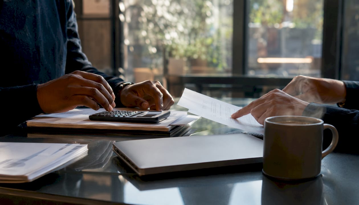 Close-up on hands calculating corporate payment