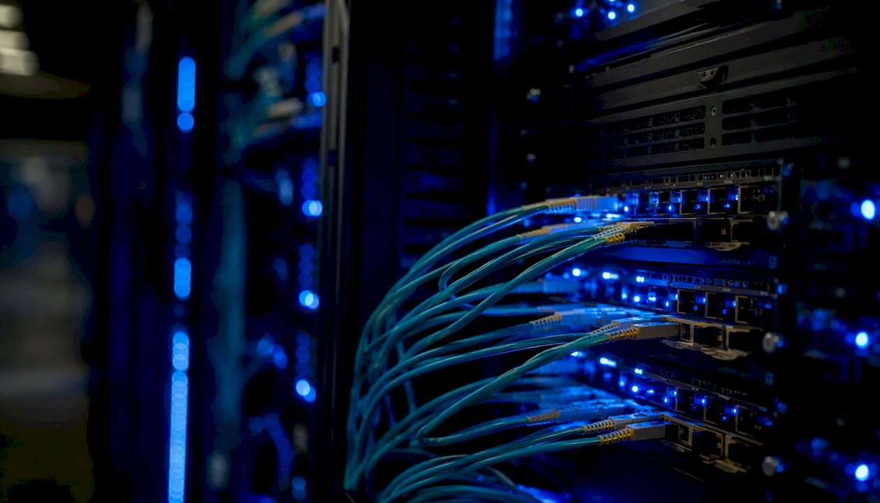 Close-up of illuminated network cables in data center