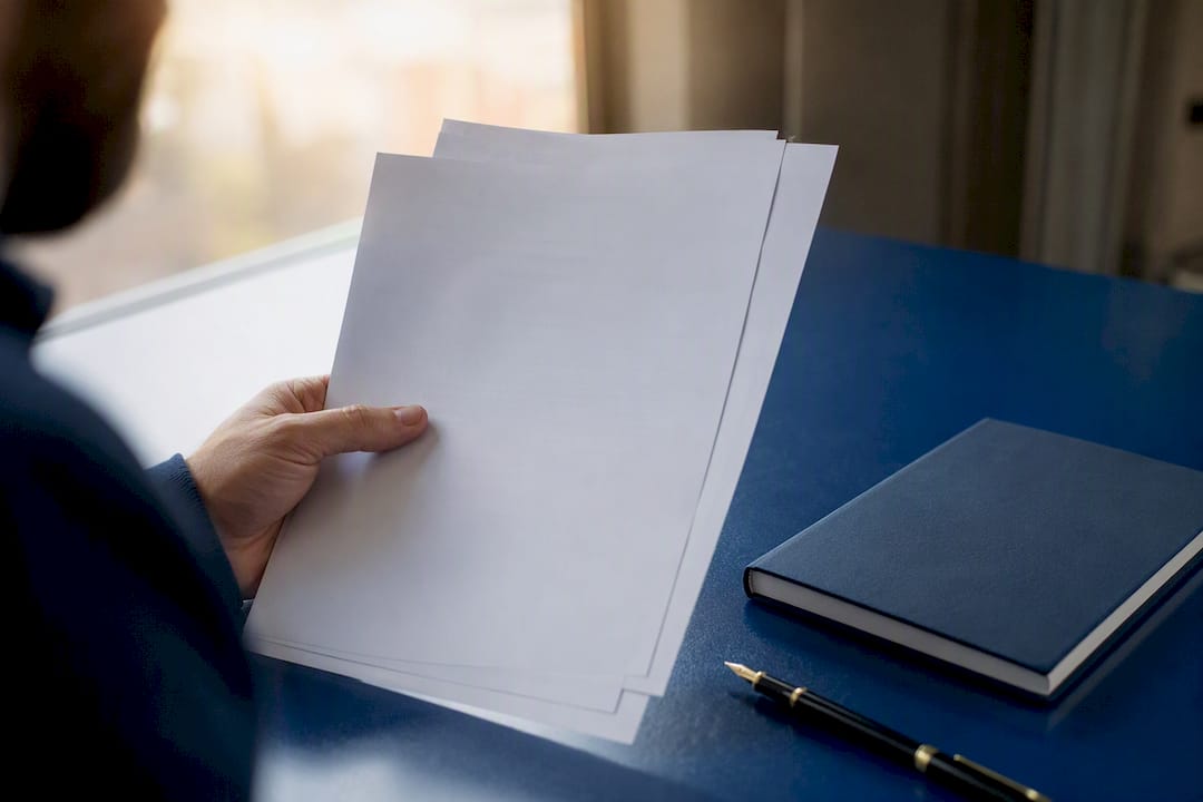Hand holding proof of registered business address documents