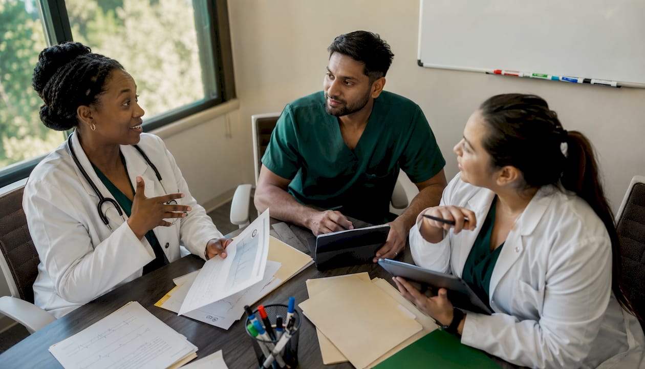 Medical team discussing diagnostic results