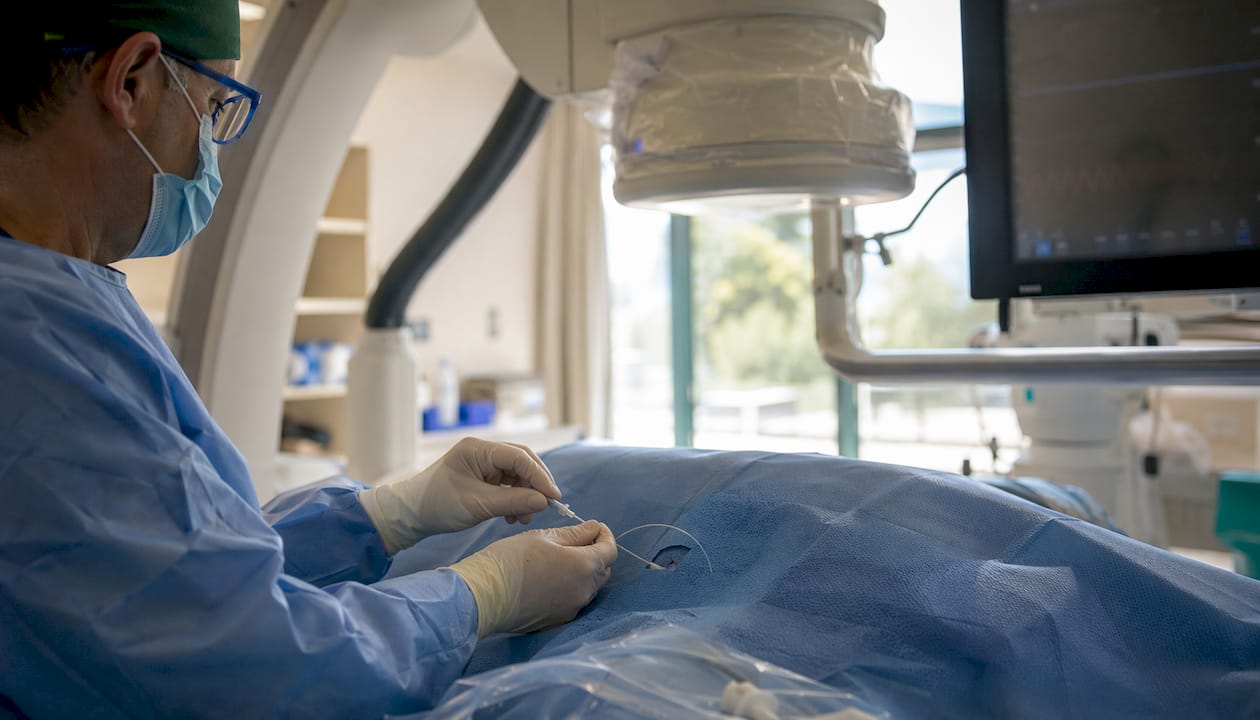 Interventional radiologist hands during procedure