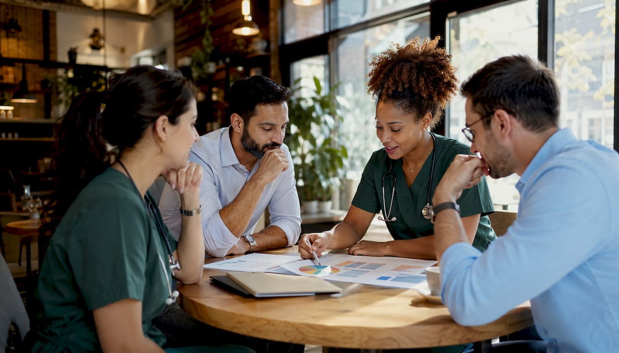 Healthcare team discussing network comparisons