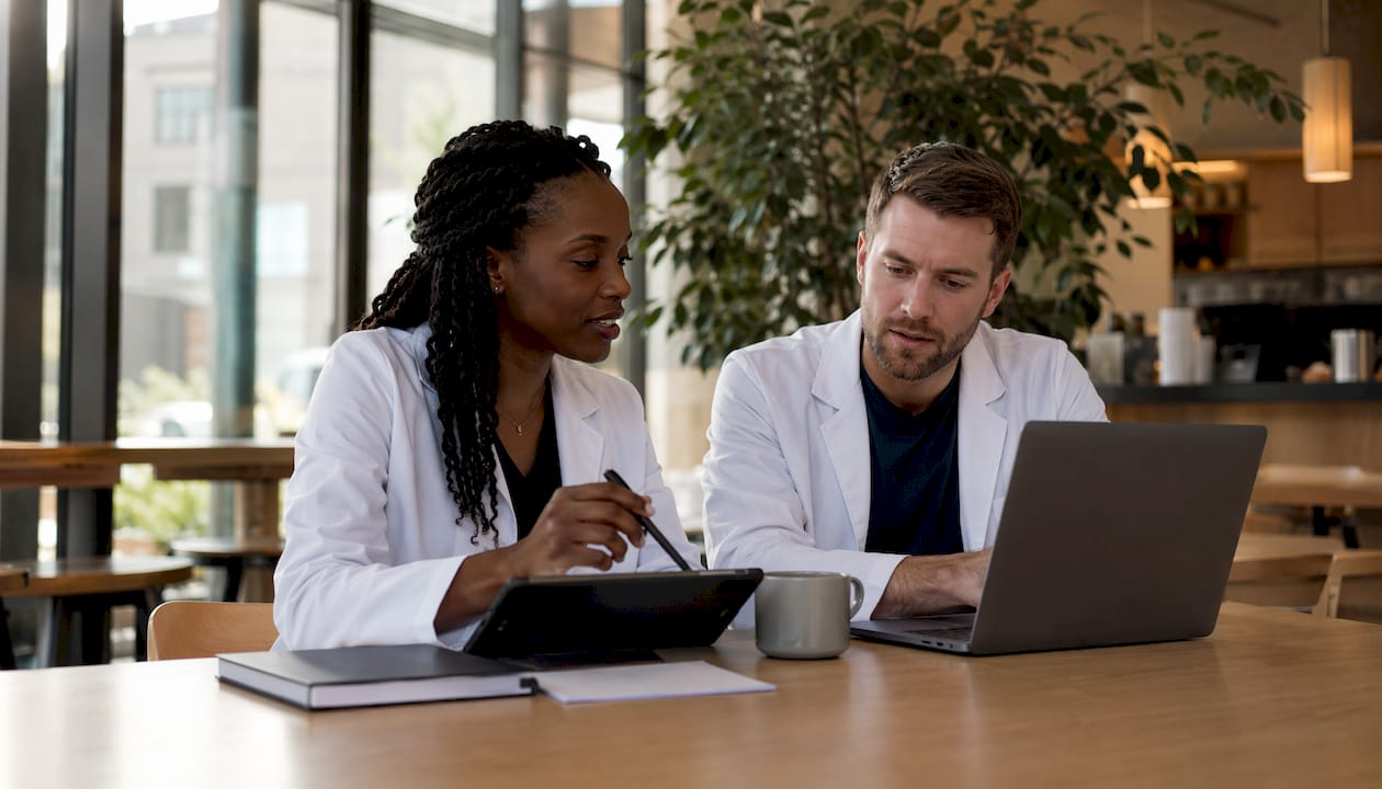 Clinicians collaborating in professional networking setting