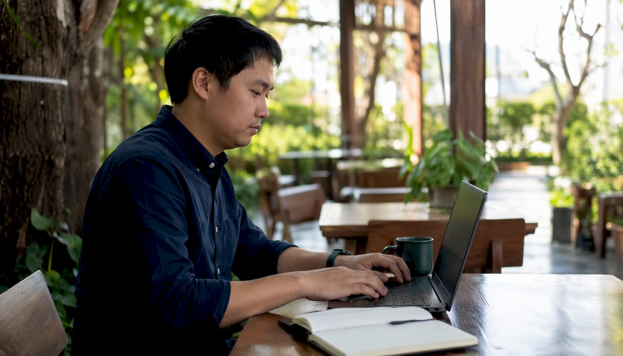 IT specialist handling telehealth cybersecurity tasks