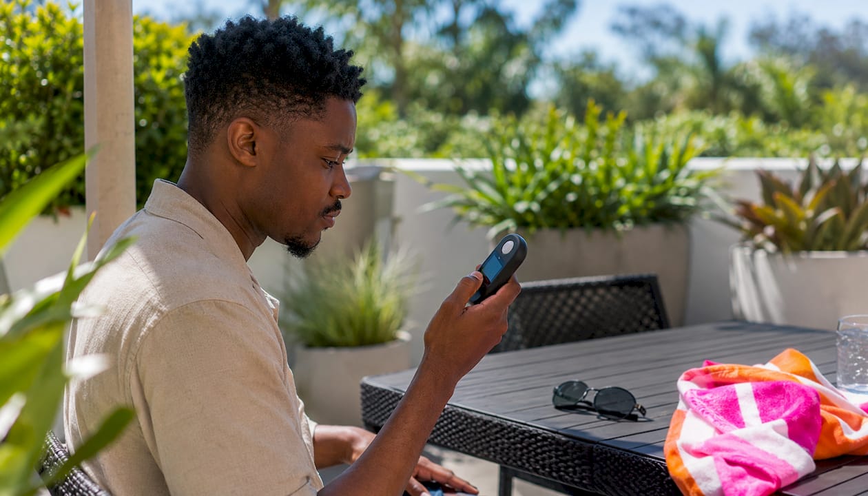 Man checking UV meter in park