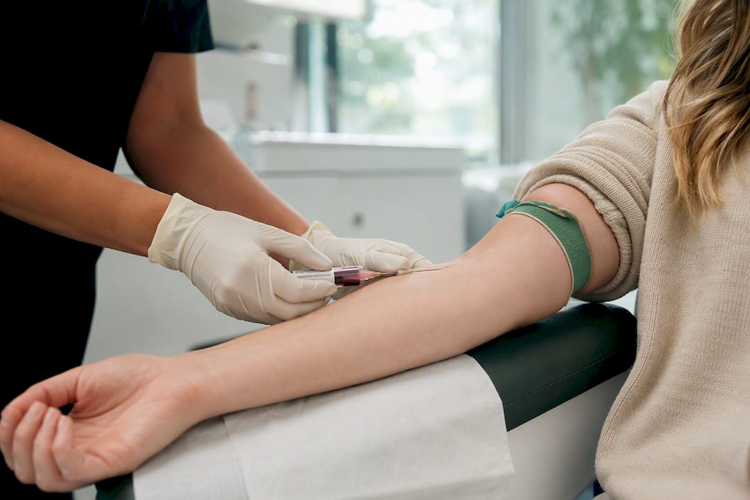 Healthcare worker drawing blood sample