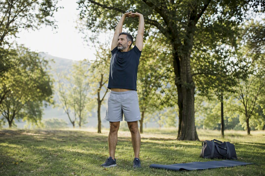 Man stretching after morning exercise
