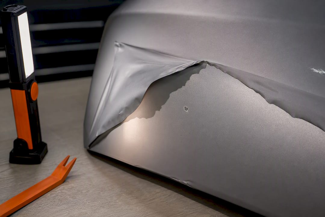 Paint chip revealed beneath removed vinyl