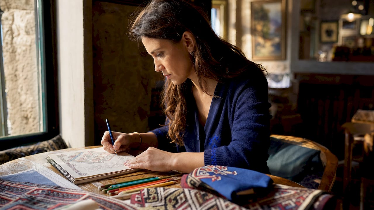 Designer creating Montenegrin-inspired textile patterns