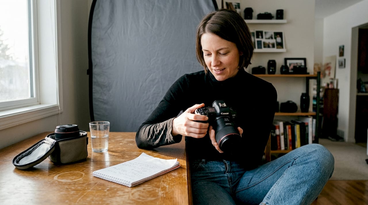 Photographer at home studio preparing for portrait shoot