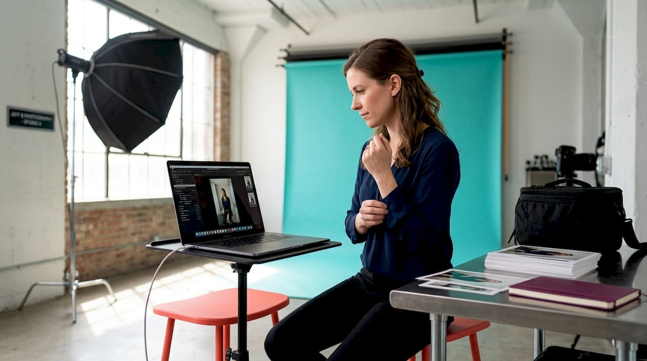 Professional woman reviewing images in studio