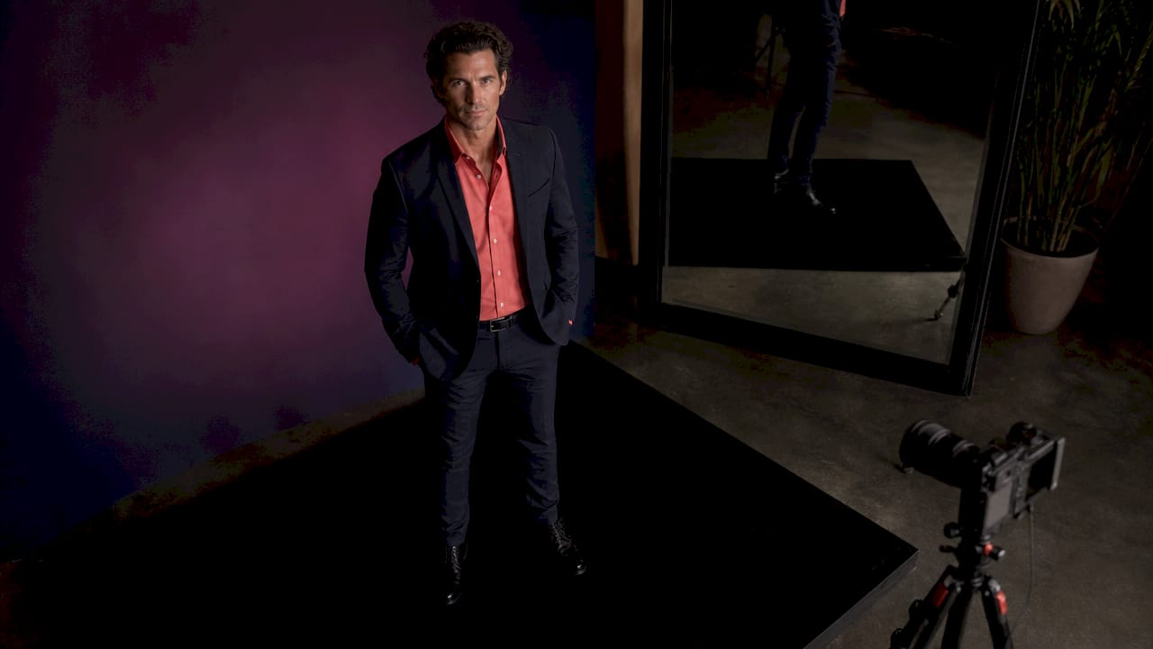 Side profile of male model lit in professional studio
