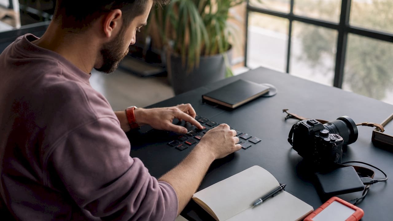 Hands organizing SD cards for photo delivery