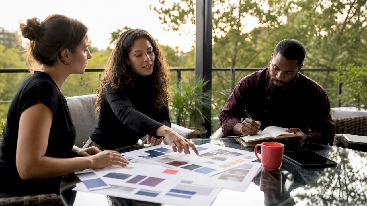 Creative team reviewing brand identity materials