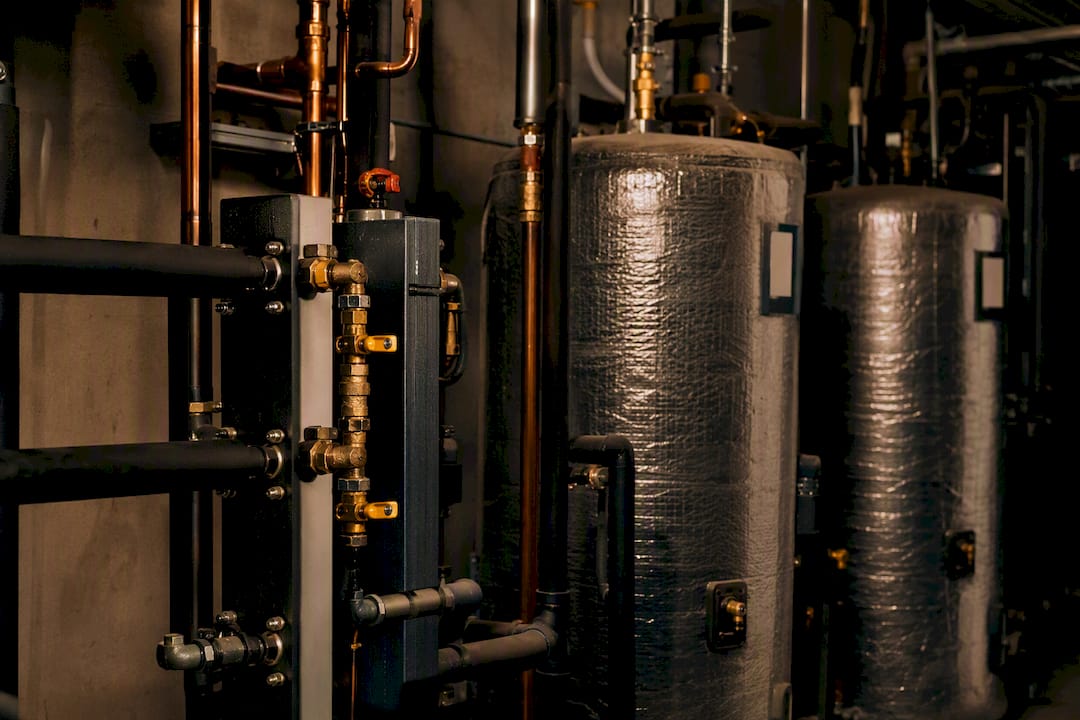 Insulated pipes and tanks in commercial mechanical room