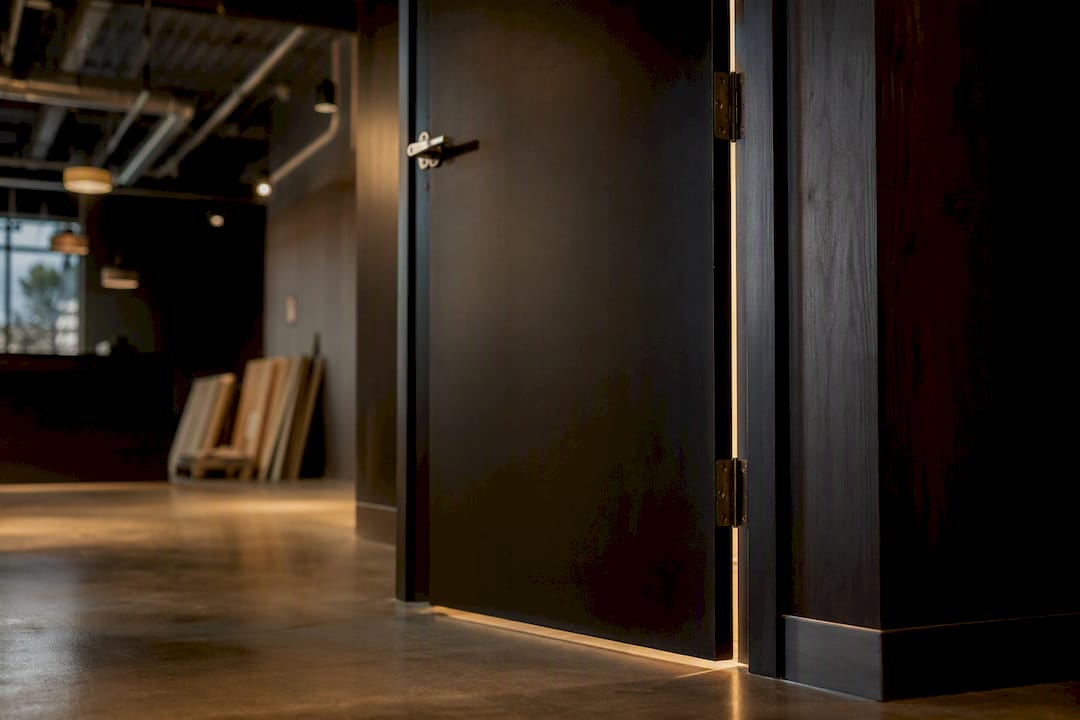 Commercial interior with solid core door partially open