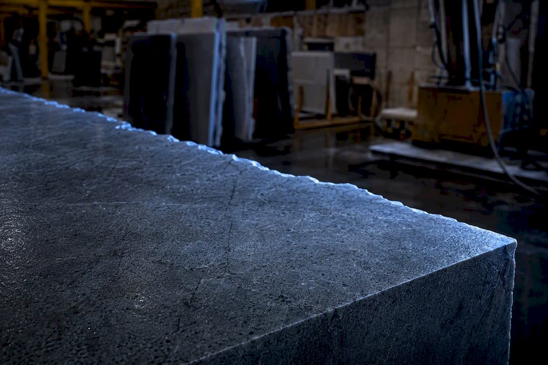 Close-up granite slab edge with cracks