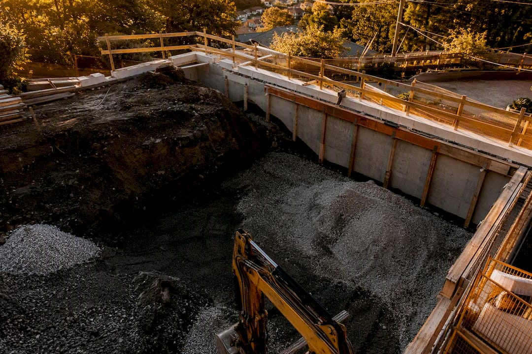Excavation work on sloped laneway house site