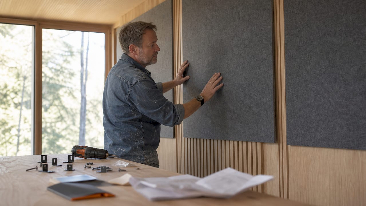 Recycled PET felt panels for interior design: 2026 guide 2 Hands installing flat acoustic PET felt panels