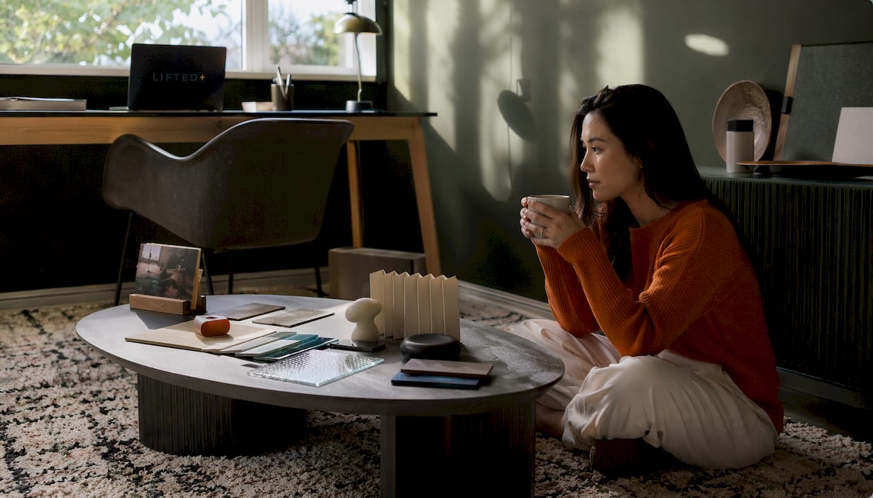 Interior styling tips 2026: warm, personal, and tactile 3 Woman enjoying calm curated styled space